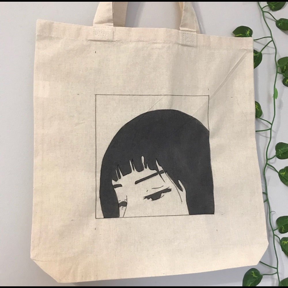 Sorrow eyes tote bag